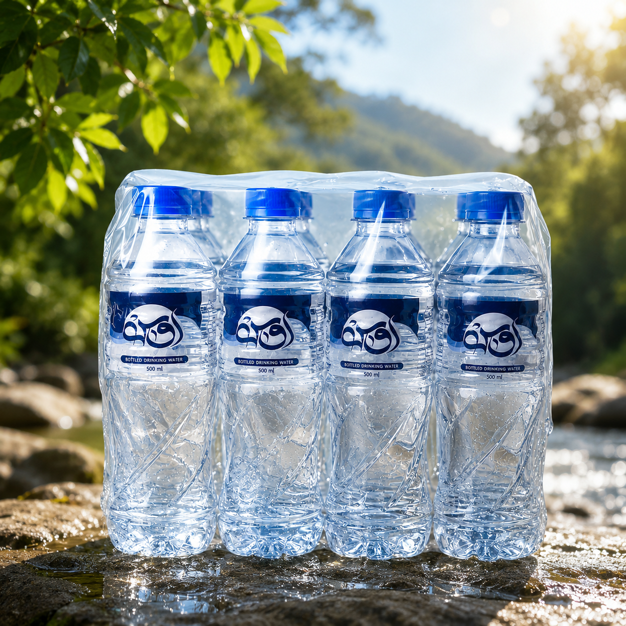 Shrink-wrapped pack of OOS Water 500 ml bottles beside a stream